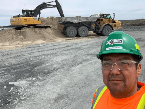 An image of a hecla employee with truck in the background.